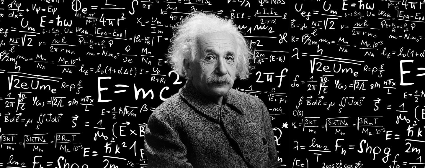 Albert Einstein in front of an illustrated chalkboard with multiple equations, the most prominent being E-MC2
